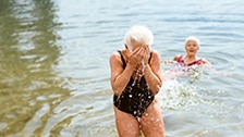 woman bathing with an ostomy